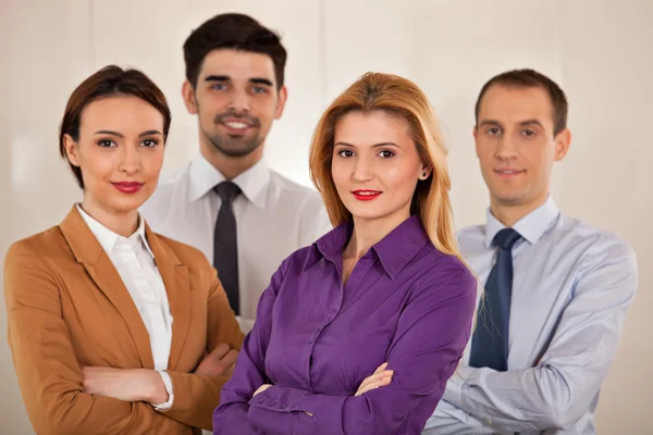 Business people smiling with crossed arms — Stock Photo, Image