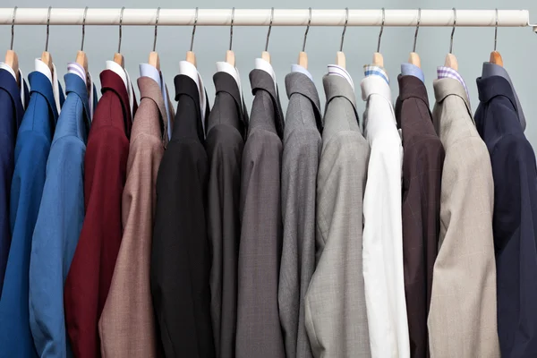 Display of man suits in a closet — Stock Photo, Image