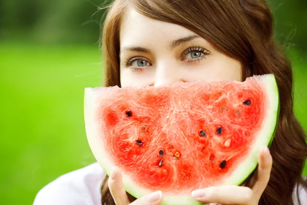 Woman with juicy watermelon in hands — Stock Photo, Image