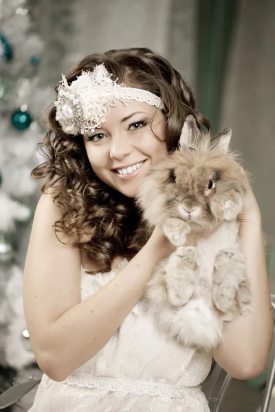 Fashion woman in luxury interior with bunny — Stock Photo, Image