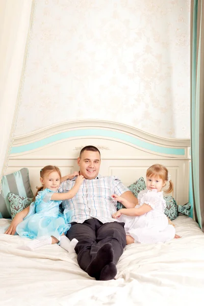 Happy family smiling at home — Stock Photo, Image