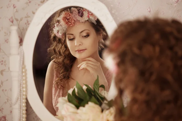 Woman in the boudoir Stock Picture