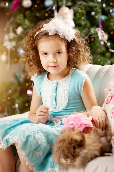 Little cute сhristmas girl with bunny Stock Photo
