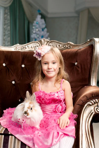 Cute smiling girl with bunny Royalty Free Stock Images