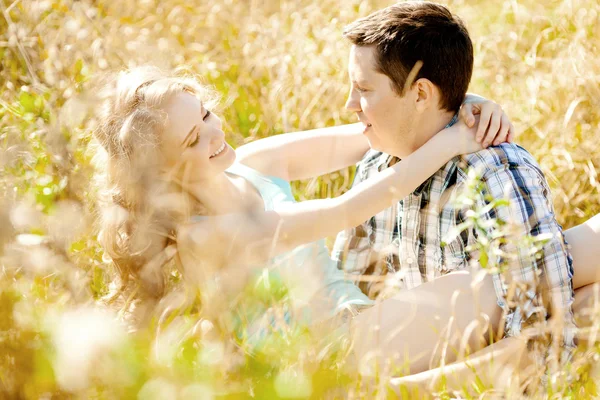 Happy young adult couple in love on the field. Two,  man and wom — Stock Photo, Image