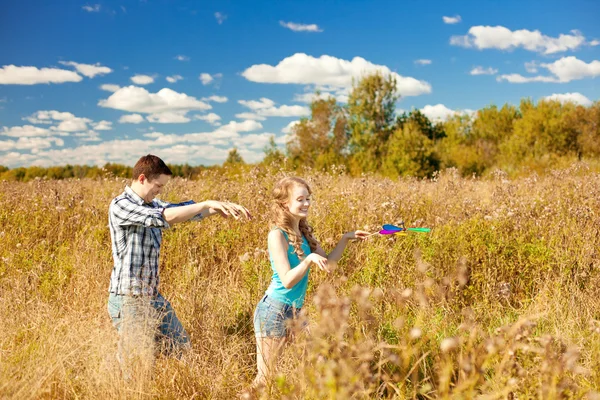 Happy young adult couple in love on the field. Two,  man and wom — Stock Photo, Image