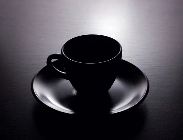 Cup of coffee on black background — Stock Photo, Image
