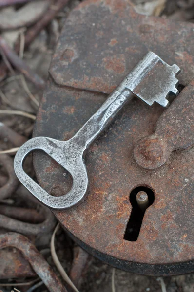 Old padlock with key — Stock Photo, Image