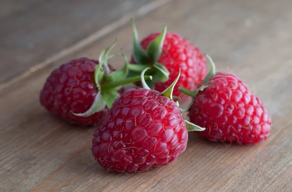 Raspberries on table — Stock Photo, Image