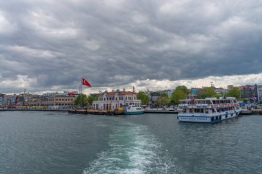 ISTANBUL, TURKEY - MAY 19.2022: View to the harbor in Kadikoy, Ferry to Istanbul. Sea voyage on the bosporus