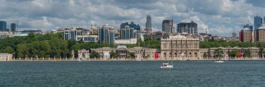 ISTANBUL, TURKEY - MAY 19.2022: Dolmabahce Palace at Besiktas in Istanbul at the Bosporus, background skyline of Istanbul