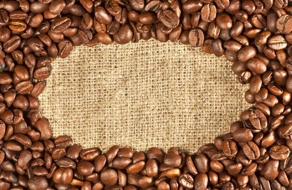 Coffee beans on sacking — Stock Photo, Image