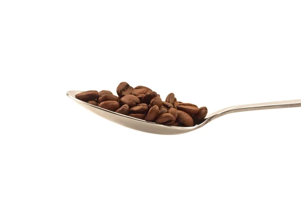 Metal spoon with coffee beans side view — Stock Photo, Image