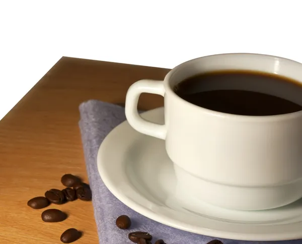 White cup of coffee on a saucer closeup — Stock Photo, Image