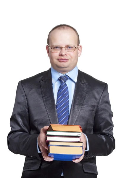 A young man in glasses holding books — Stock Photo, Image