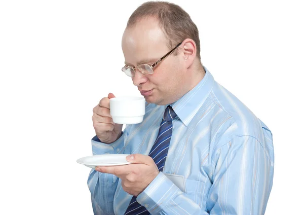 Young man with glasses drinking tea — Stock Photo, Image