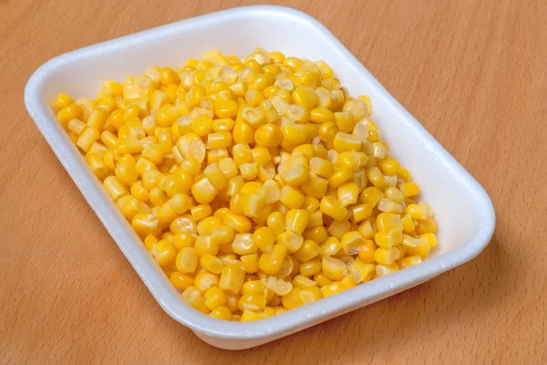 Corn grain in the container — Stock Photo, Image
