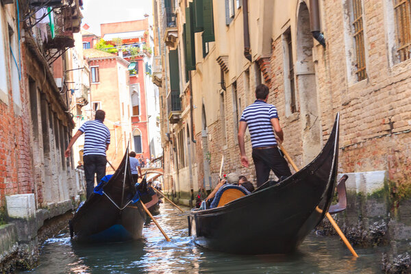 Gondolas floating on the canal in Venice