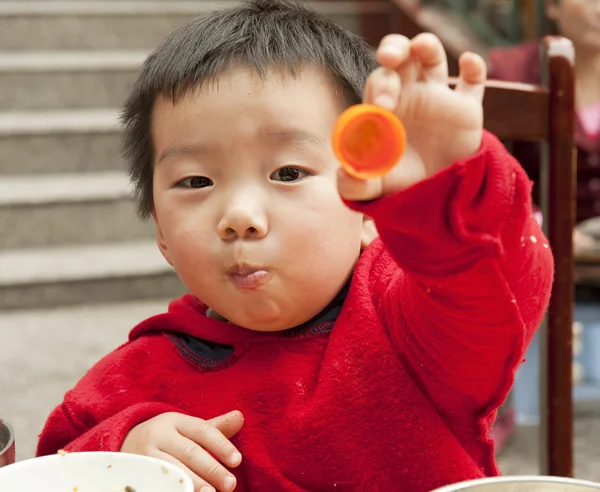 A kid baby is eating — Stock Photo, Image