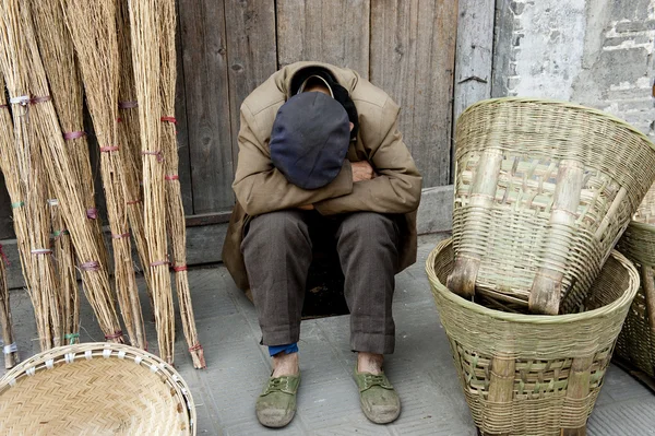 Sleeping man and traditional hand tools — Stock Photo, Image