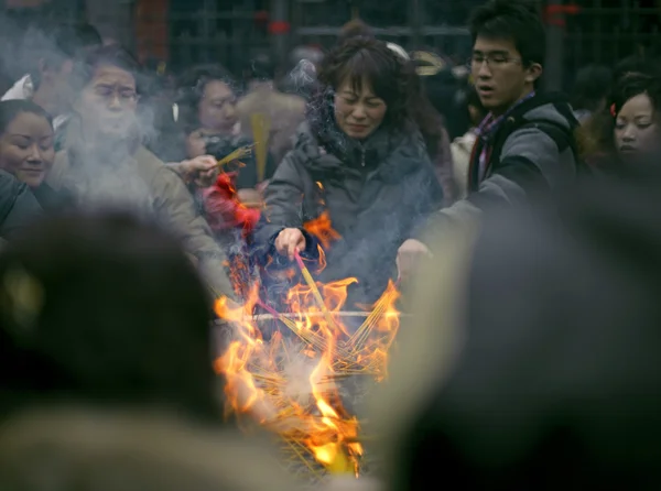 Burning incense upon the incense altar in temple — Stock Photo, Image