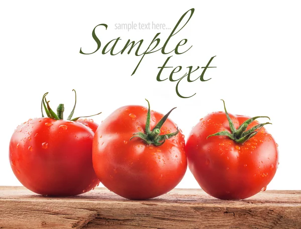 Tomatoes on a wooden background — Stock Image Tomatoes on a wooden background Royalty Free Stock Images