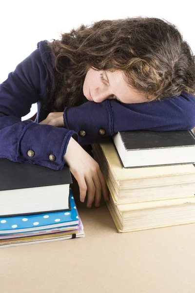 Adolescente durmiendo en sus libros Imagen de stock