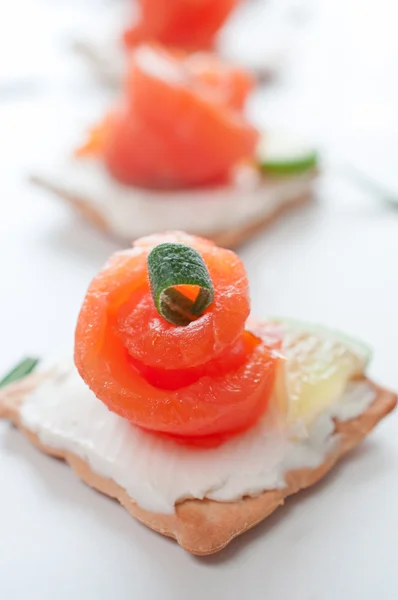 Canapes with smoked salmon — Stock Photo, Image