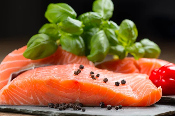 Fresh salmon fillet on rock — Stock Photo, Image