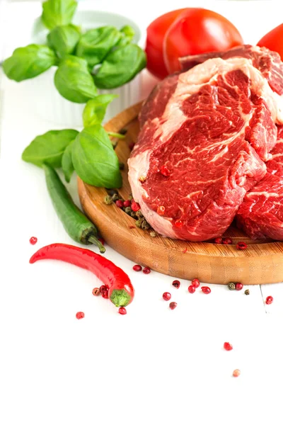 Organic Red Raw Steak on cutting board — Stock Photo, Image