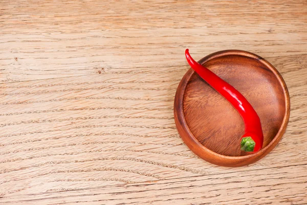 Fresh red and green chili pepper on wooden bowl — Stock Photo, Image