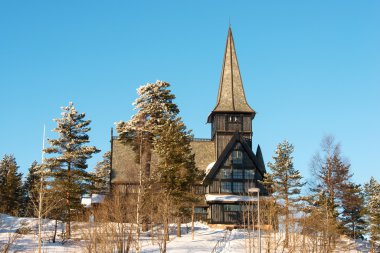 Old Holmenkollen chapel on sunny winter day Oslo Norway clipart