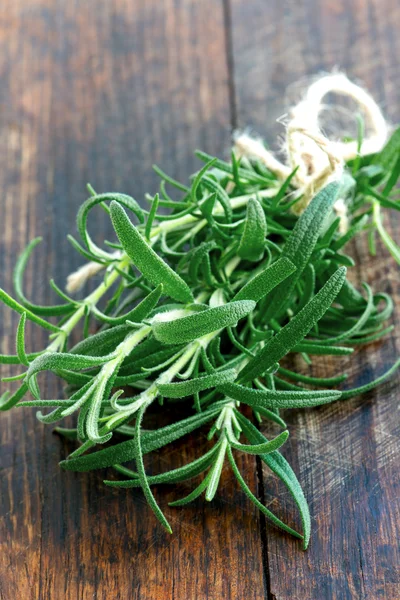 Fresh rosemary on a wooden board Stock Image