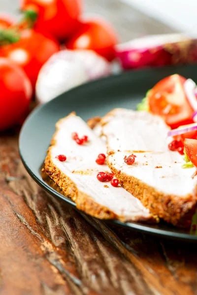 Set of oven baked pork in plate and ingredients — Stock Photo, Image