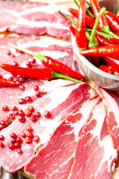 Cured meat with chilli pepper — Stock Photo, Image