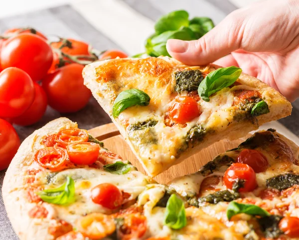 Italian pizza  with hand — Stock Photo, Image