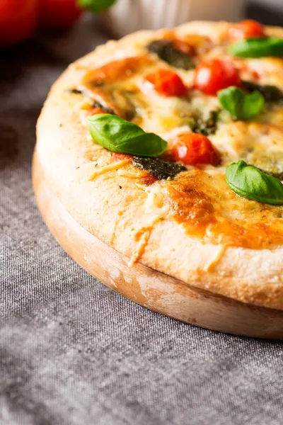 Italian pizza on tablecloth — Stock Photo, Image