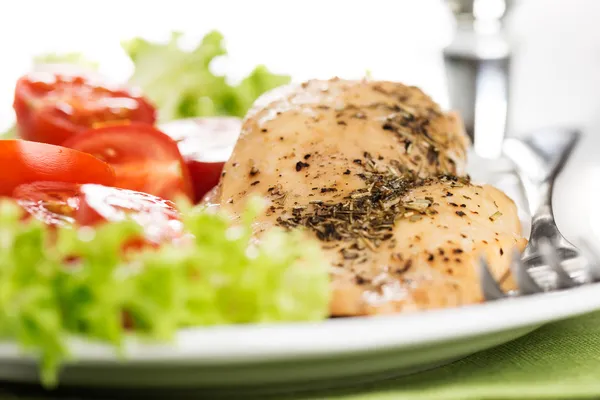 Chicken meet with tomatoes — Stock Photo, Image