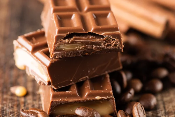 Coffee, chocolate and cinnamon sticks — Stock Photo, Image