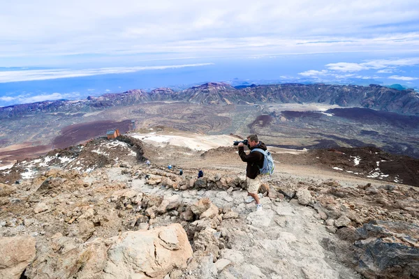 Man taking picture at top volcano Teide horizontal — Stock Photo, Image