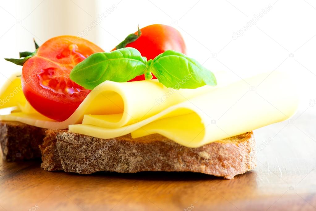 Sandwich with cheese tomatoes and basil