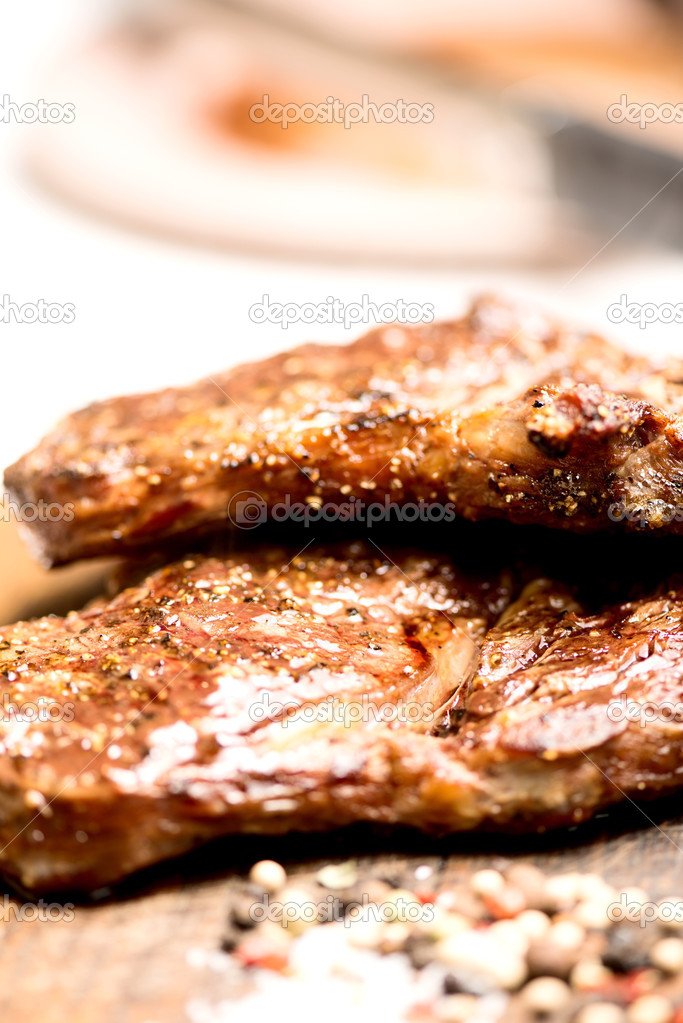 Grilled steaks with salt and pepper