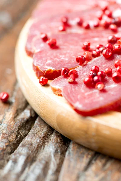 Cured meat with pepper — Stock Photo, Image