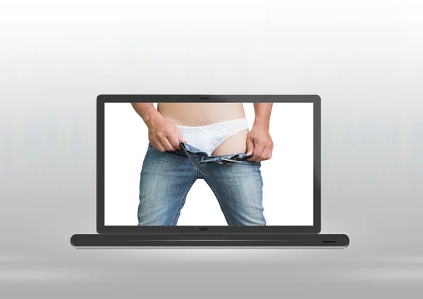 Man takes off jeans — Stock Photo, Image