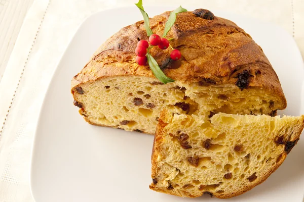 Panettone, a typical Christmas cake on a plate — Stock Photo, Image