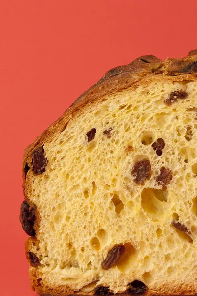 Panettone, a typical Christmas cake over a red background — Stock Photo, Image