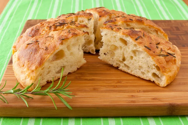 Homemade round Italian rosemary Focaccia bread sliced. — Stock Photo, Image