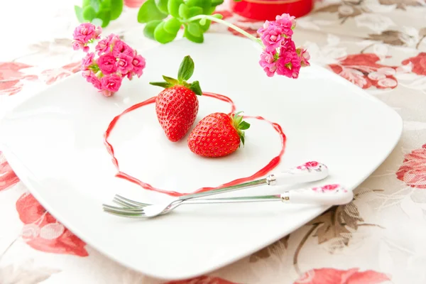 Fresh strawberries as romantic dessert on a plate in heart sha — Stock Photo, Image