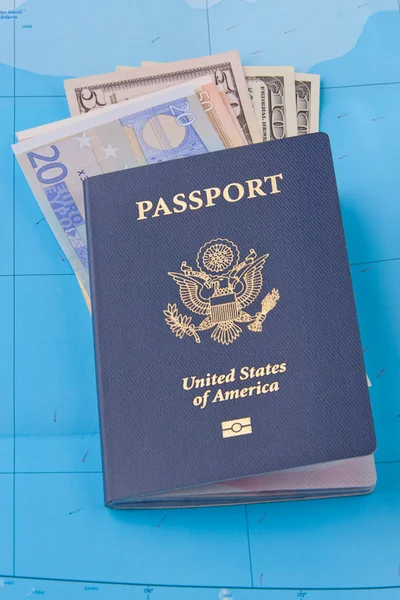 American passport, euros and dollars on map background for trav