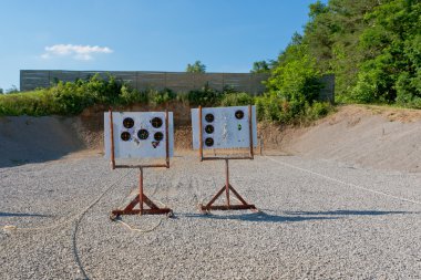 Outdoor pistol shooting range with targets . clipart